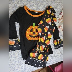 Size 110, fit like a 4t, so adorable,  does have wash wear